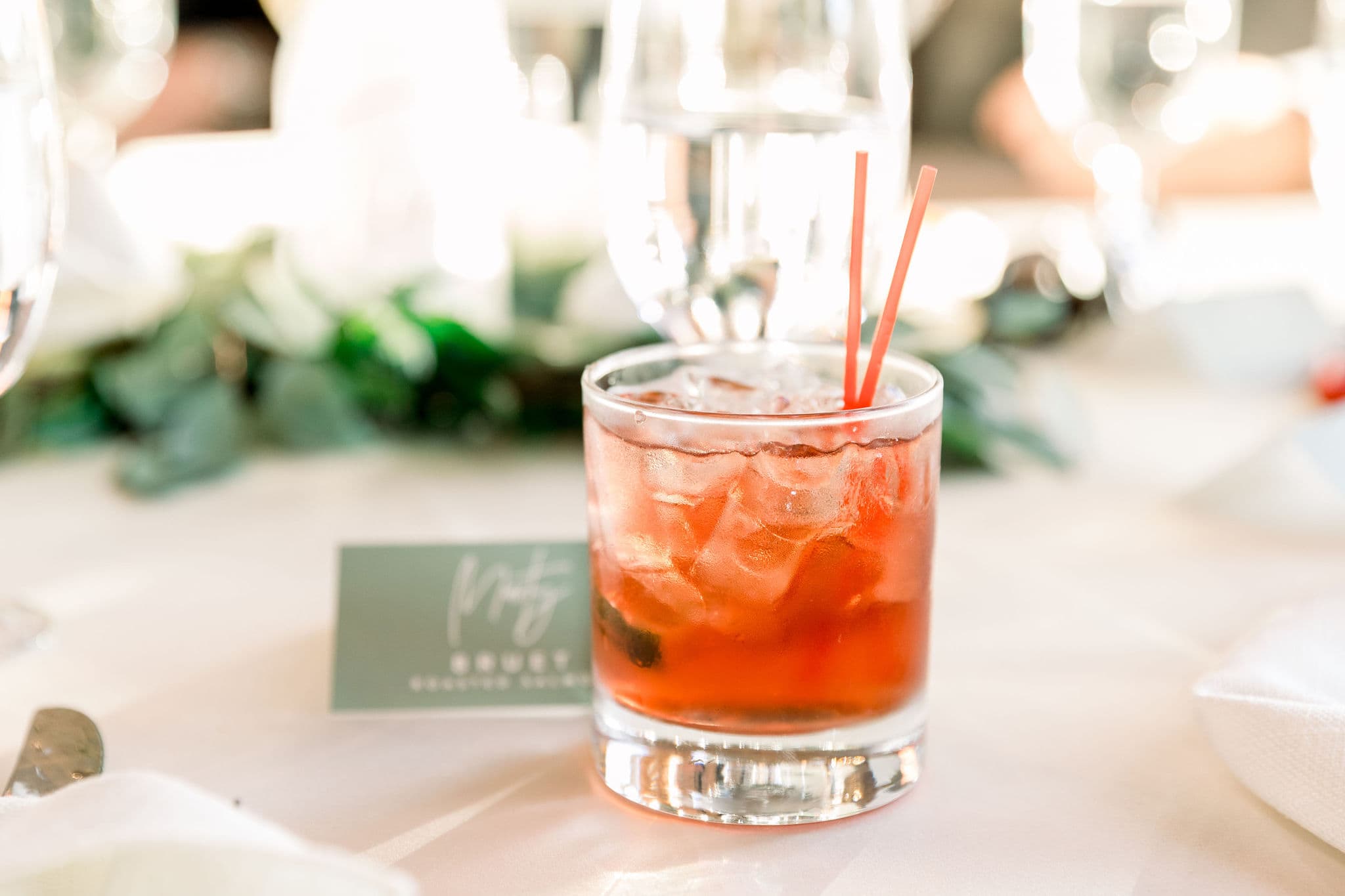 A signature cocktail on a wedding reception table — Photo by Tiffany Johnson Photography